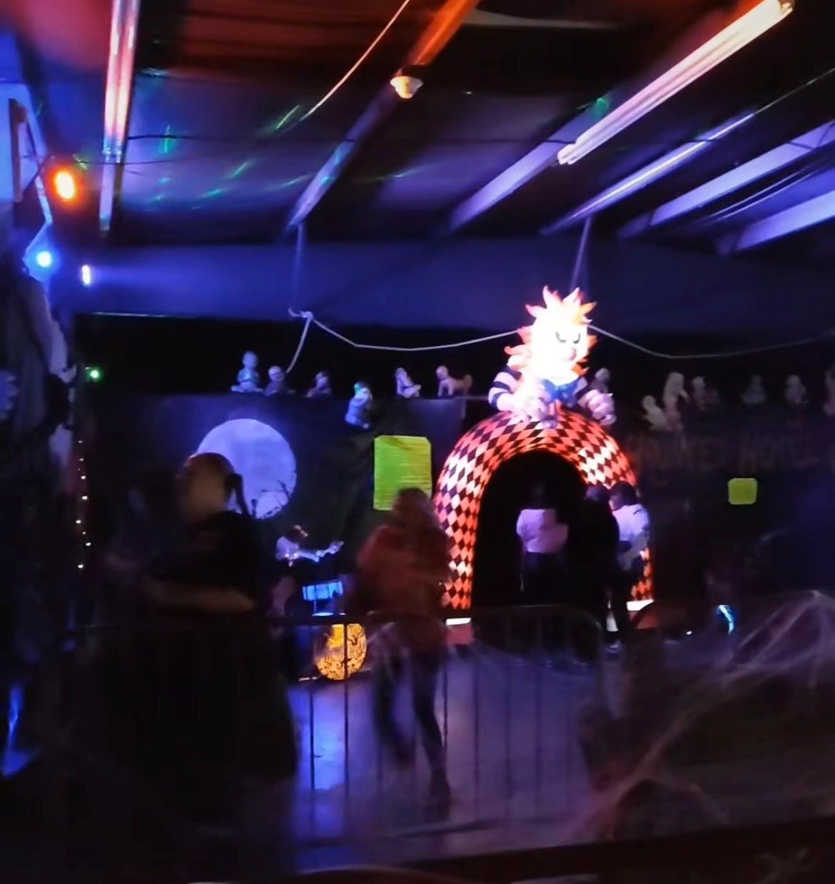 Haunted Hotel interior with neon lights and immersive displays
